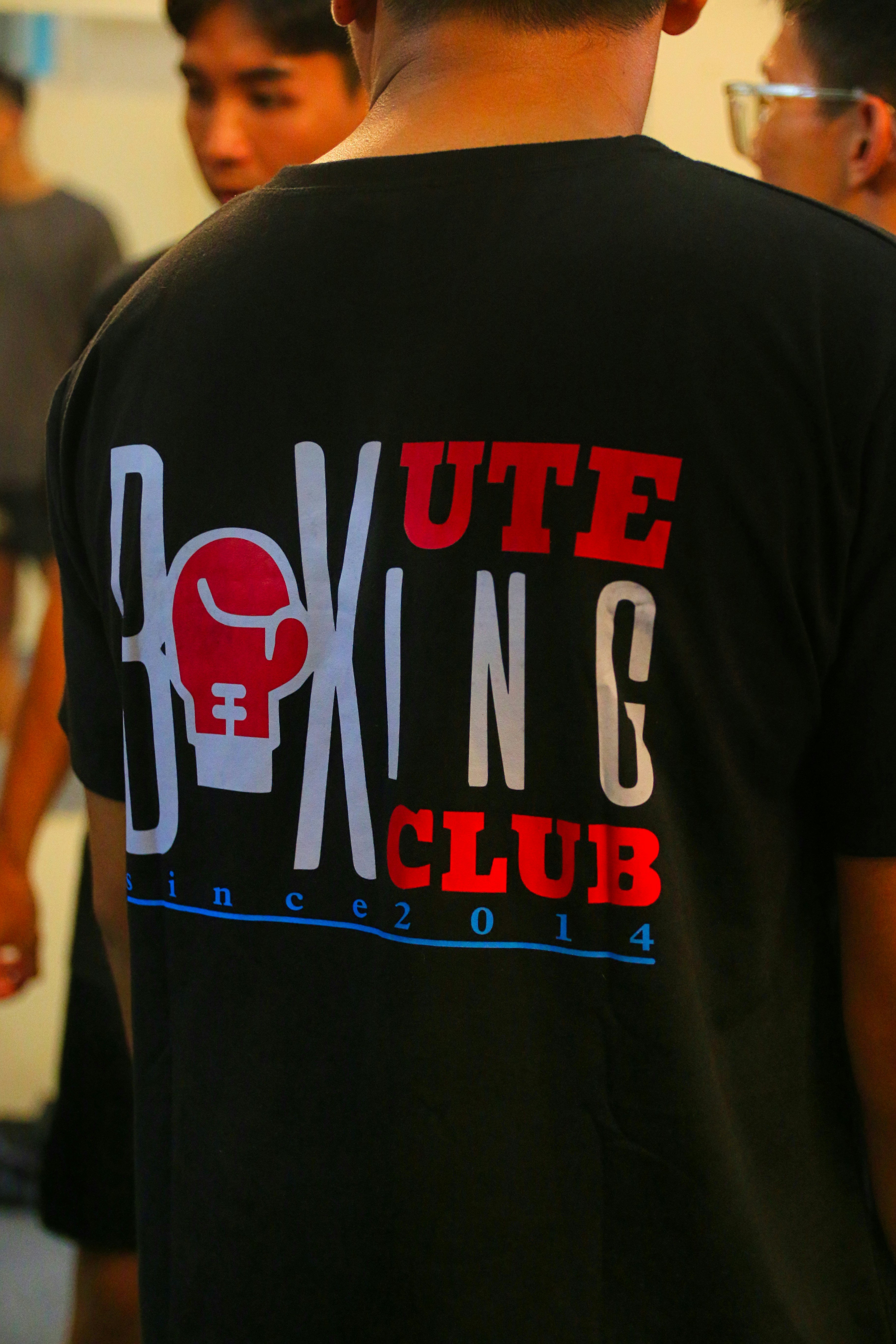 Black crew neck t-shirt with bold car club logo graphic on front
